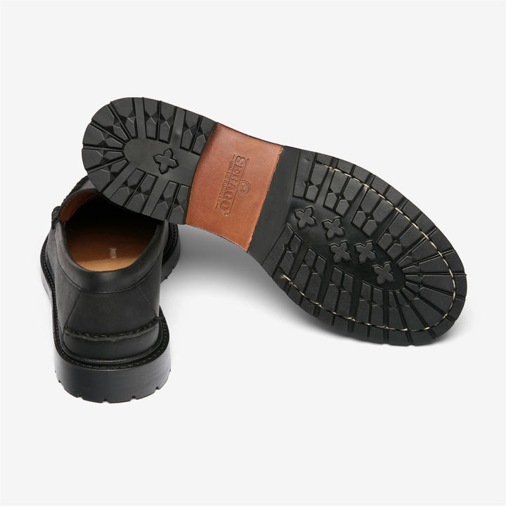 Mocasines de cuero negro para hombre con construcción Blake tradicional. 4