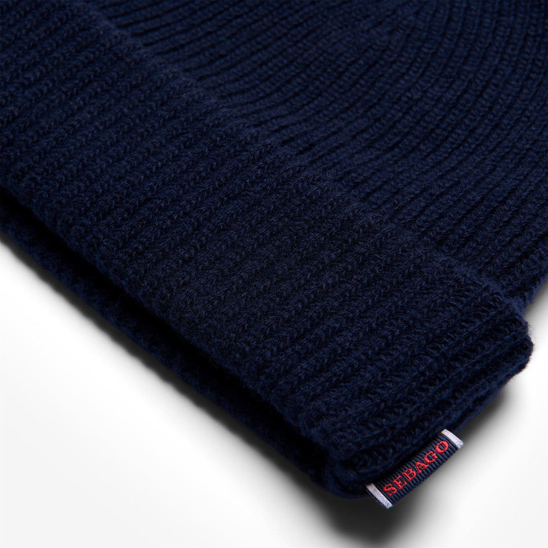 Gorro de punto de lana unisex azul oscuro con vuelta main